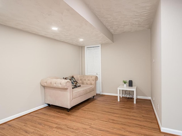 4136 Queen Ave S Unit 108, Minneapolis, MN 55410 - sitting room with baseboards, light wood-style floors, recessed lighting, and a textured ceiling
