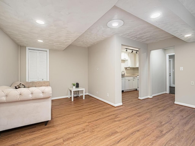 4136 Queen Ave S Unit 108, Minneapolis, MN 55410 - living room with light wood-style floors, baseboards, and recessed lighting