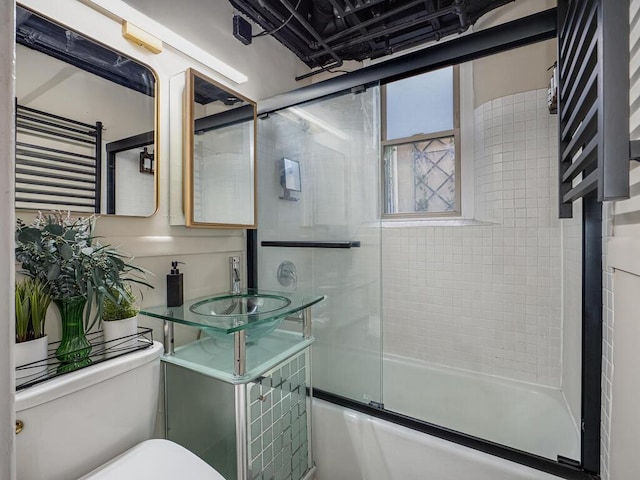4136 Queen Ave S Unit 108, Minneapolis, MN 55410 - full bathroom with a sink, toilet, shower / bath combination with glass door, and a towel warmer