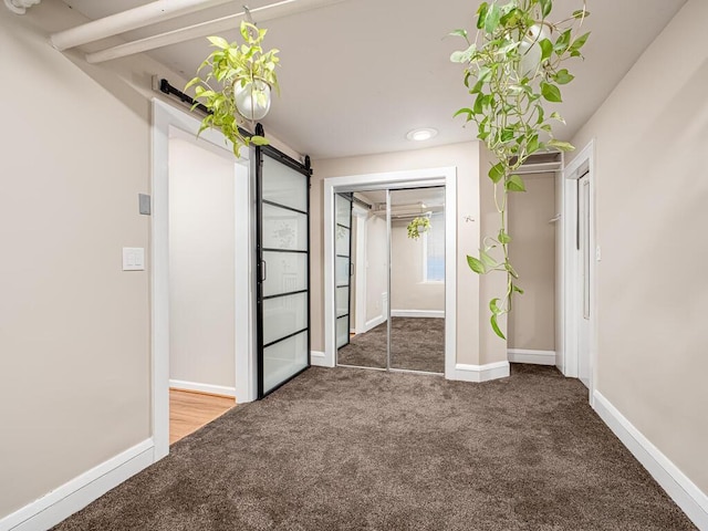 4136 Queen Ave S Unit 108, Minneapolis, MN 55410 - unfurnished bedroom with carpet flooring, a barn door, and baseboards