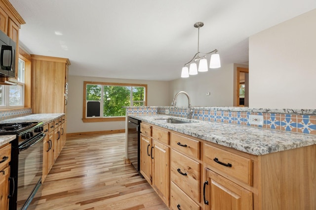 4963 Crofoot Ave NW, Buffalo, MN 55313 - kitchen with black gas range oven, light wood finished floors, dishwasher, light stone counters, and hanging light fixtures