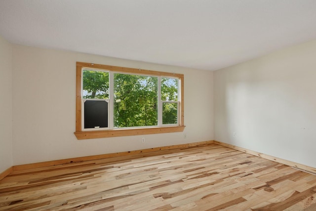 4963 Crofoot Ave NW, Buffalo, MN 55313 - empty room featuring wood finished floors and baseboards