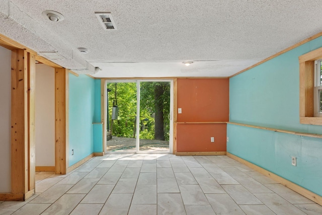 4963 Crofoot Ave NW, Buffalo, MN 55313 - empty room with plenty of natural light and a textured ceiling