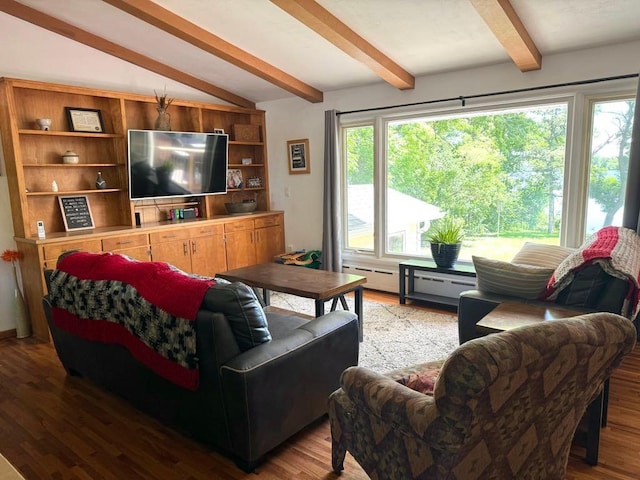 living area with wood finished floors and lofted ceiling with beams