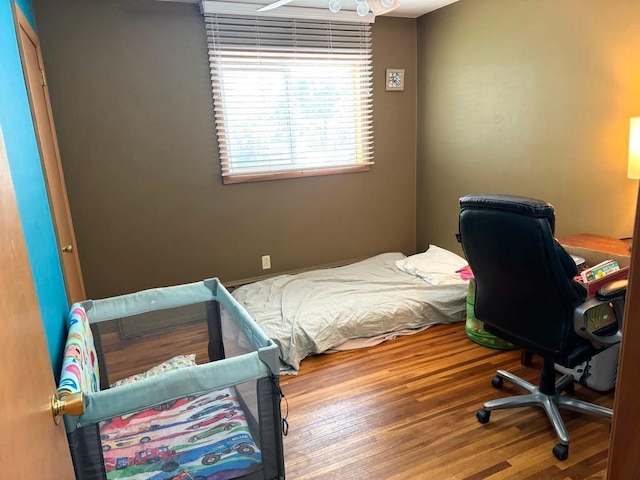 bedroom with wood finished floors