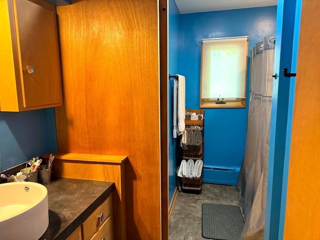 bathroom featuring unfinished concrete floors, a shower with shower curtain, and vanity