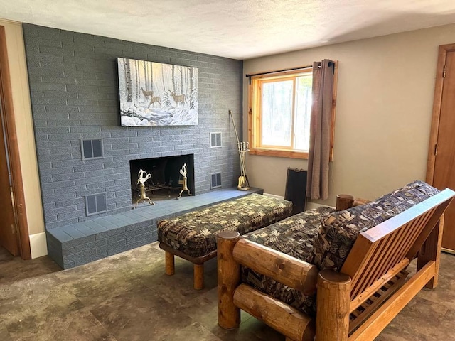 bedroom featuring visible vents and a fireplace