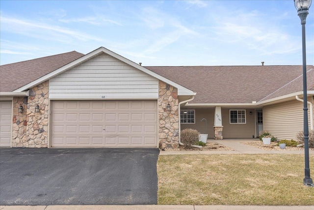 68 Crown Pointe Curv, Hudson, WI 54016 - ranch-style house featuring a garage, driveway, stone siding, and a shingled roof