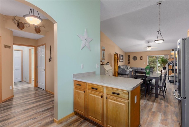68 Crown Pointe Curv, Hudson, WI 54016 - kitchen featuring freestanding refrigerator, a ceiling fan, wood finished floors, light countertops, and open floor plan