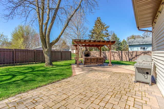 view of patio / terrace featuring grilling area, a pergola, and a fenced backyard