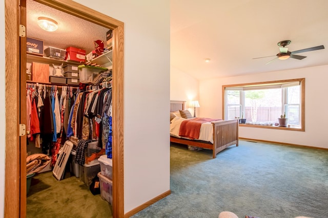 carpeted bedroom with baseboards, vaulted ceiling, and a closet