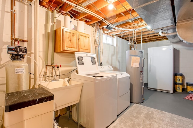 laundry area with washing machine and clothes dryer, cabinet space, and electric water heater