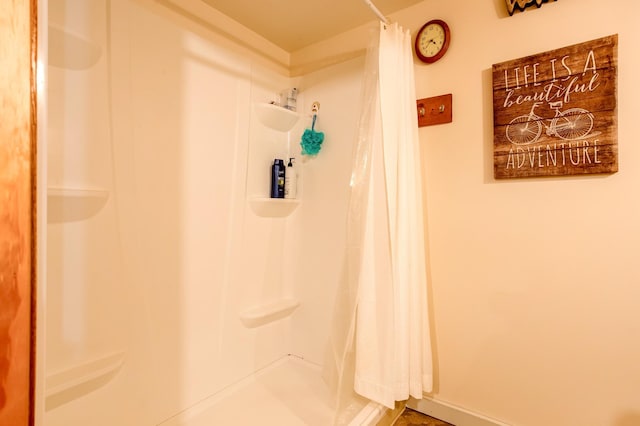 full bath with a shower with shower curtain