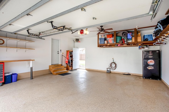 garage featuring ceiling fan and a garage door opener
