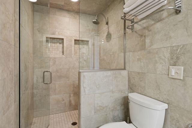 full bath featuring a stall shower and toilet