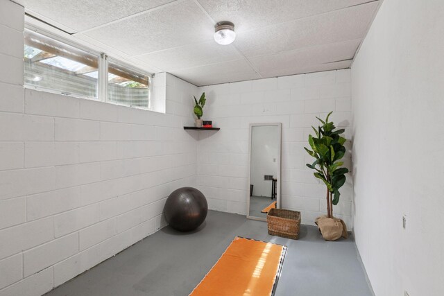 workout room with concrete block wall