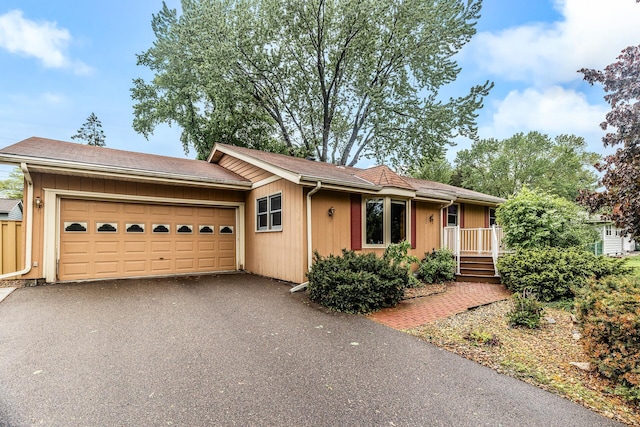 722 Navajo Ln, Mendota Heights, MN 55120 - ranch-style house with an attached garage and asphalt driveway