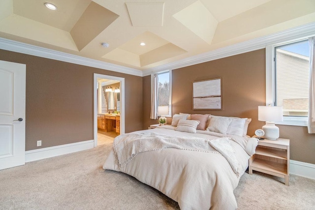 bedroom with recessed lighting, light colored carpet, ornamental molding, ensuite bathroom, and baseboards