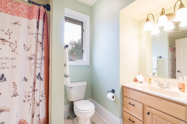 bathroom featuring vanity, toilet, baseboards, tile patterned flooring, and a shower with shower curtain