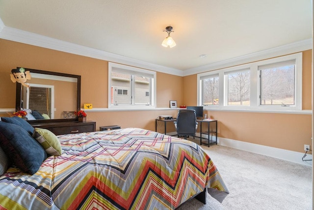 carpeted bedroom with baseboards and crown molding