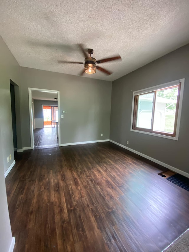 104 3rd St, Buffalo Lake, MN 55314 - empty room with ceiling fan, wood finished floors, baseboards, and a textured ceiling