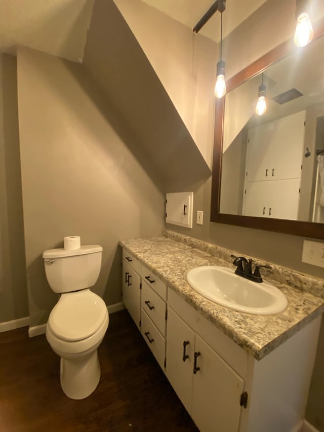 104 3rd St, Buffalo Lake, MN 55314 - bathroom with vanity, wood finished floors, toilet, and baseboards