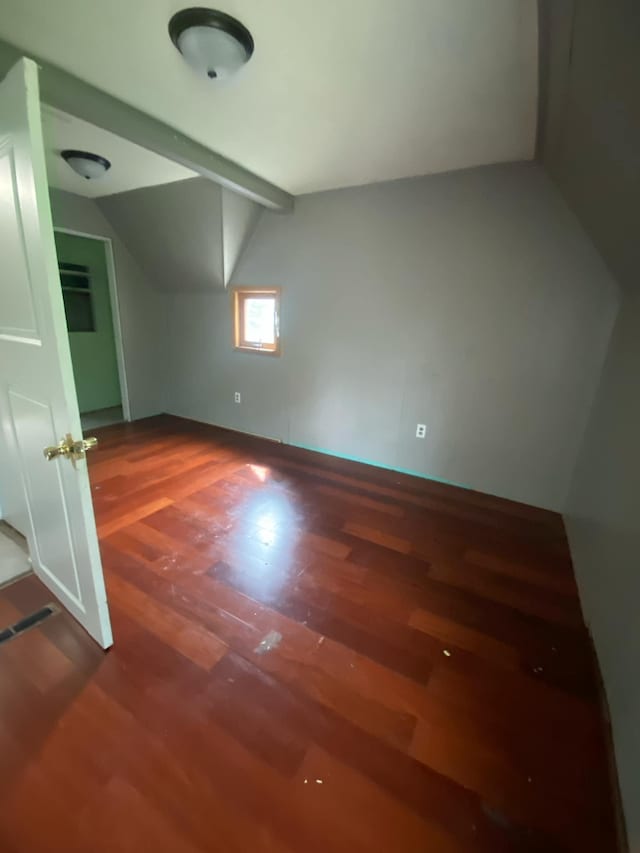 104 3rd St, Buffalo Lake, MN 55314 - spare room featuring lofted ceiling, wood finished floors, and baseboards