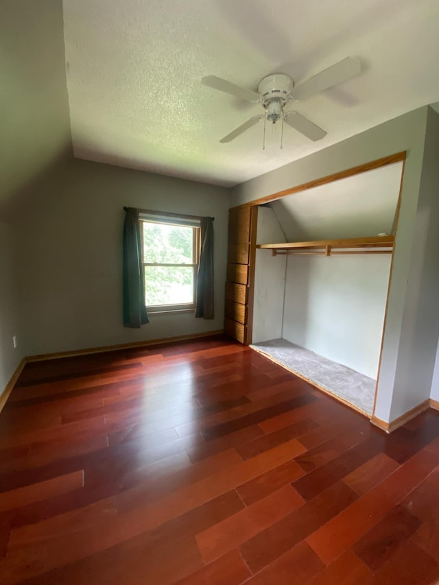104 3rd St, Buffalo Lake, MN 55314 - unfurnished bedroom featuring wood finished floors, ceiling fan, lofted ceiling, and a closet