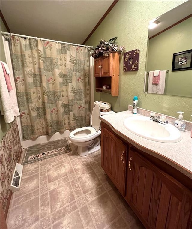 bathroom with toilet, visible vents, lofted ceiling, curtained shower, and vanity