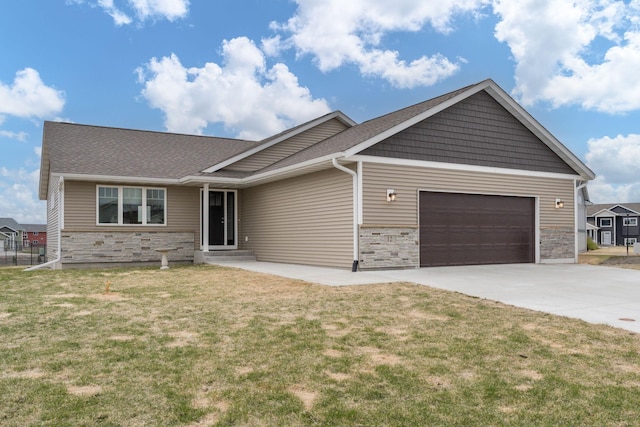 12 Kodiak Ct, North Mankato, MN 56003 - ranch-style home with a garage, a front lawn, stone siding, and concrete driveway