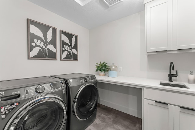 5012 Hankerson Ave, Edina, MN 55436 - laundry room featuring independent washer and dryer, cabinet space, and wood finished floors