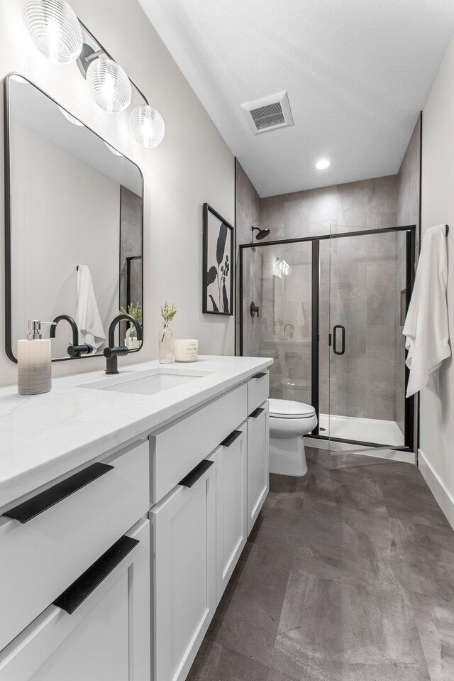 5012 Hankerson Ave, Edina, MN 55436 - bathroom with vanity, a shower stall, and recessed lighting
