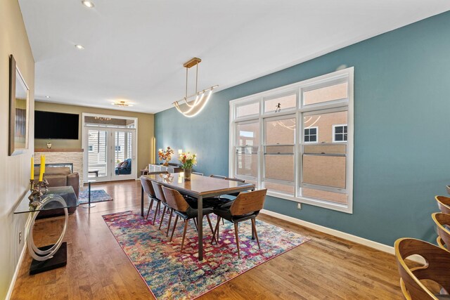 222 Ridgewood Ave, Minneapolis, MN 55403 - dining room with wood finished floors, baseboards, and a fireplace