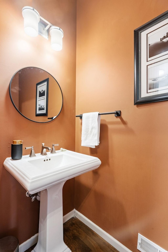 222 Ridgewood Ave, Minneapolis, MN 55403 - bathroom with baseboards and wood finished floors