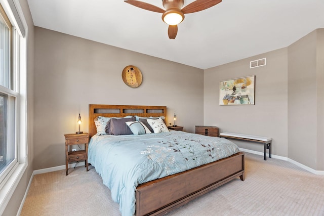 222 Ridgewood Ave, Minneapolis, MN 55403 - bedroom featuring light colored carpet, baseboards, and multiple windows