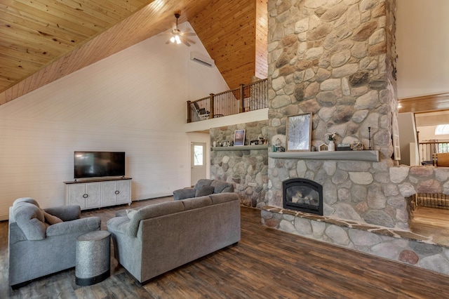 living room with high vaulted ceiling, wood ceiling, a fireplace, a ceiling fan, and wood finished floors