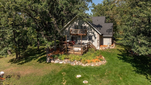 view of front of property featuring a front lawn, a deck, and a balcony