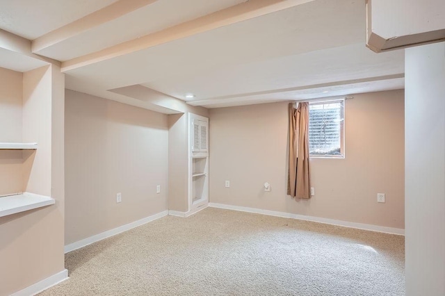 below grade area featuring carpet floors and baseboards