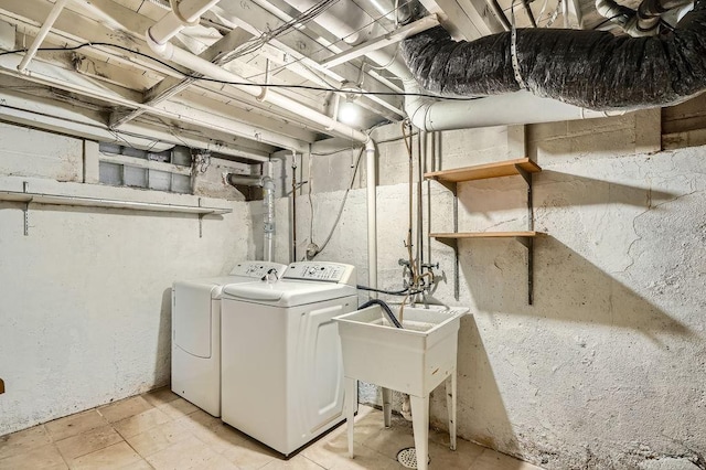clothes washing area featuring independent washer and dryer and laundry area