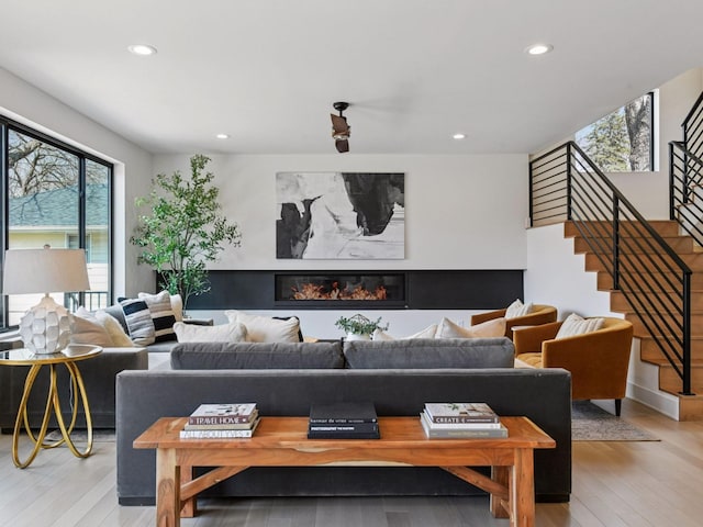 251 Glenbrook Rd N, Wayzata, MN 55391 - living room featuring stairs, light wood-style flooring, and recessed lighting