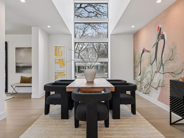 251 Glenbrook Rd N, Wayzata, MN 55391 - dining space with recessed lighting, wood finished floors, baseboards, and a towering ceiling