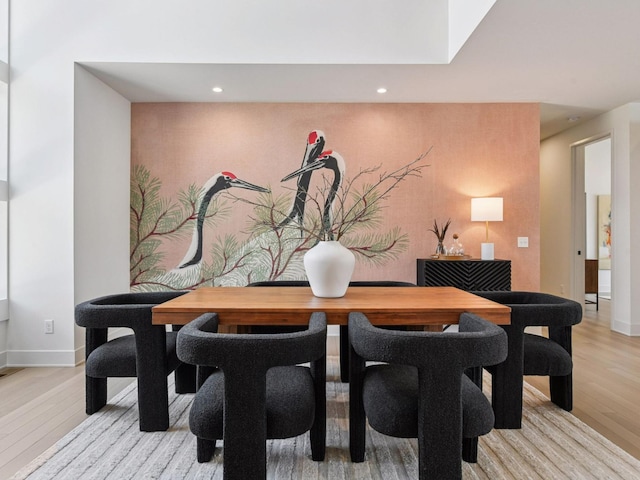251 Glenbrook Rd N, Wayzata, MN 55391 - dining space featuring light wood finished floors, baseboards, recessed lighting, and an accent wall