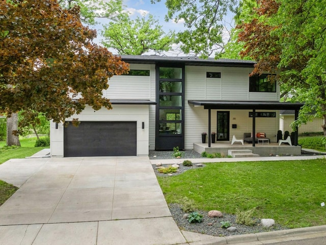 251 Glenbrook Rd N, Wayzata, MN 55391 - contemporary house with covered porch, a front lawn, concrete driveway, and a garage
