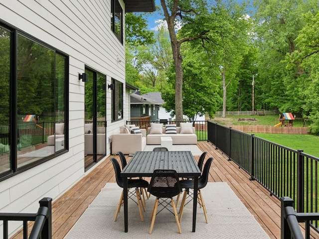 251 Glenbrook Rd N, Wayzata, MN 55391 - wooden deck featuring a playground, an outdoor living space, and outdoor dining area