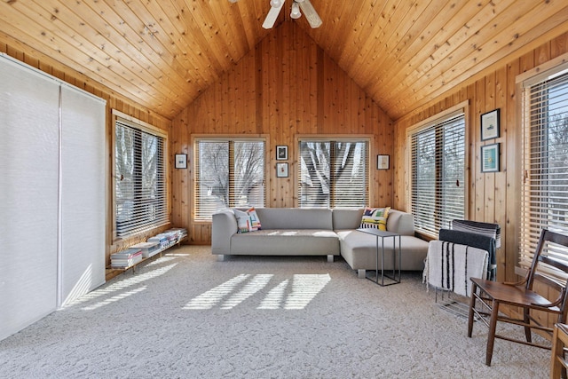 1001 Gramsey Pl, Burnsville, MN 55306 - carpeted living area with vaulted ceiling, wooden walls, and ceiling fan