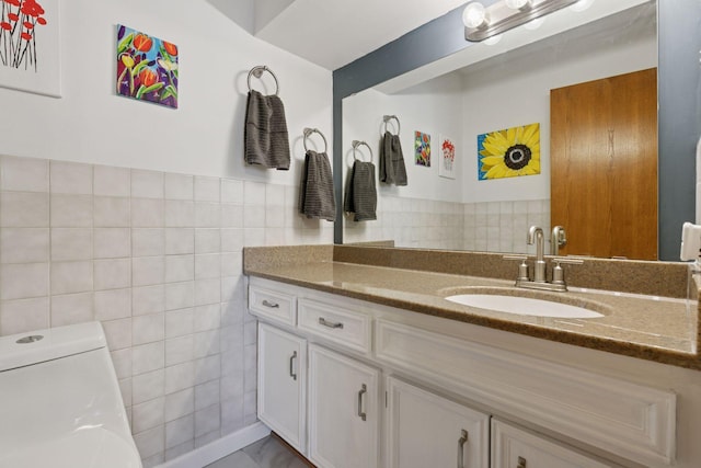 1001 Gramsey Pl, Burnsville, MN 55306 - bathroom with tile walls, vanity, and toilet