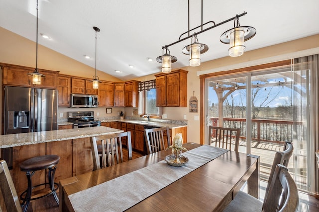 dining room with dark wood finished floors, lofted ceiling, and recessed lighting
