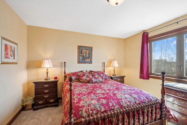 bedroom with carpet floors and baseboards