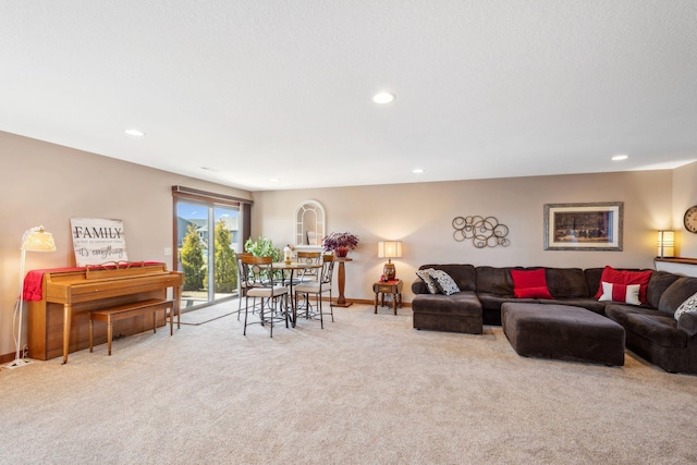 carpeted living room featuring recessed lighting and baseboards