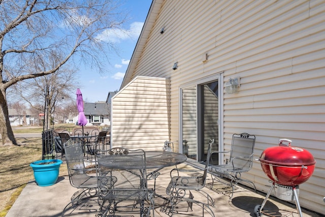view of patio featuring grilling area and outdoor dining area